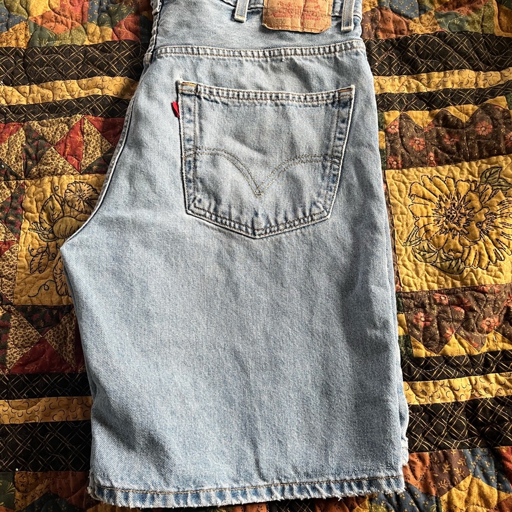 Vintage Levi's light blue denim shorts with tan leather patch
